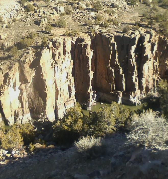 27- on the road  above the cliffs that fall at least 700 feet to the river, you can see the high.jpg