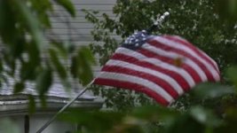american-flag-blowing-in-rain-storm-4k_nyvpahgfe__S0000.jpg